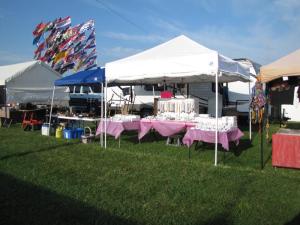 The Hideout behind a 30' space with two canopies and 10' open selling area.