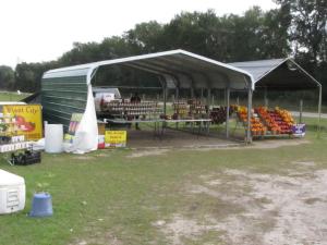 The produce stand by the side of the road.