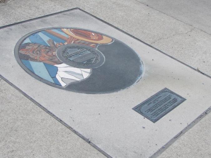 Louis Armstrong honored on the sidewalk next to the remains of the old recording studio. There are many musicians so honored.