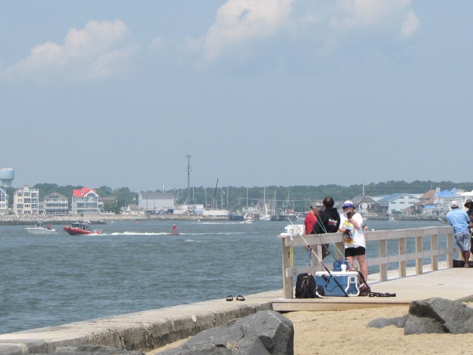 Fishing from the sidewalk at the South Inlet parking lot