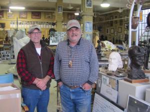 Alan Cottrill, left, with Maj inside Alan's Studio and Gallery