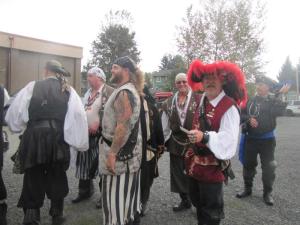 A "handsome" gathering of scalawags and hooligans. Can you tell who is the Captain?